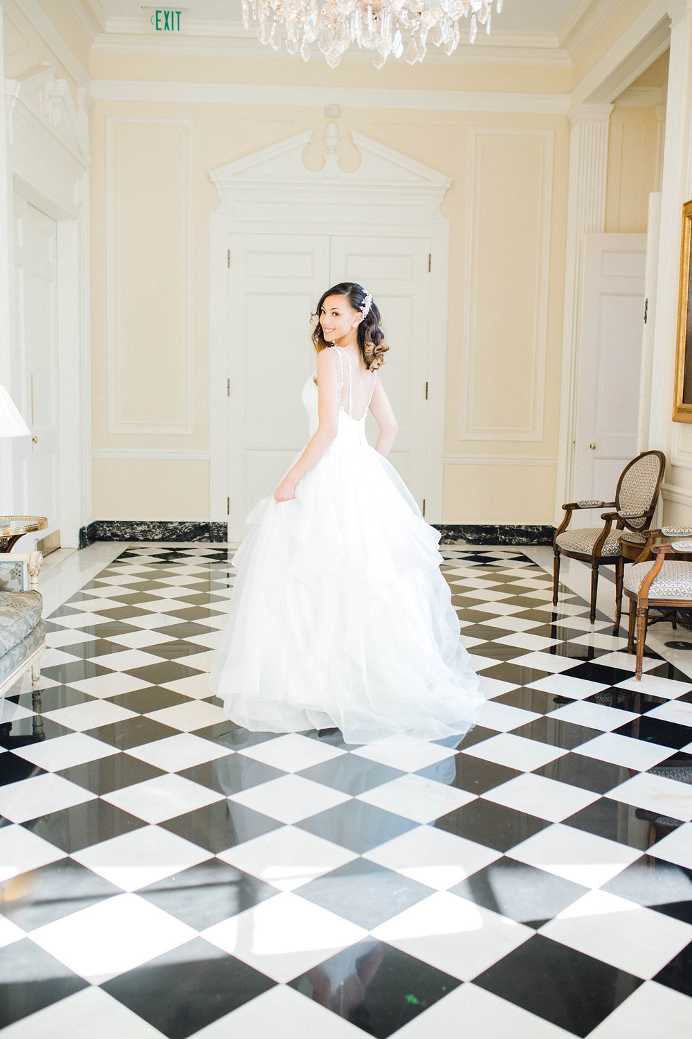A bride on a checkerboard floor at the Duke Mansion in Charlotte, NC