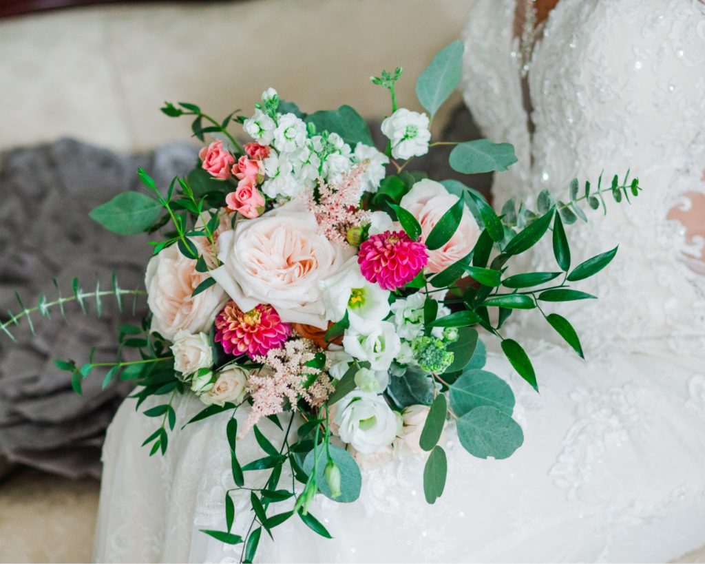 A blush and hot pink bridal bouquet designed by Flowers on Broad Street in the bridal suite at the Highgrove Estate.