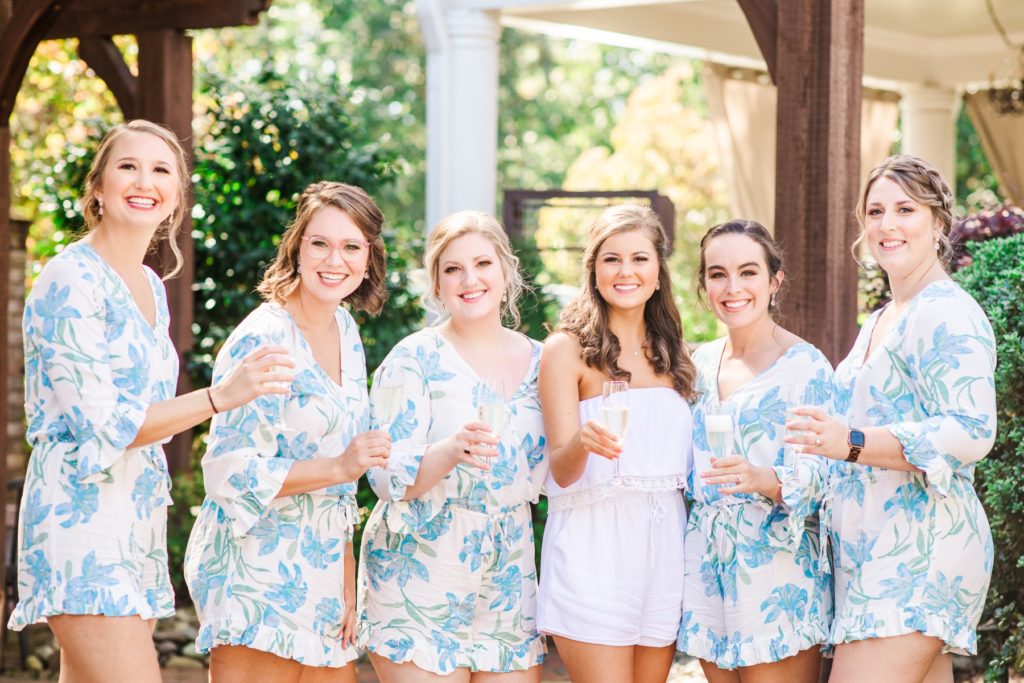 Bridesmaids toasting to the bride on her wedding day at the Highgrove Estate.