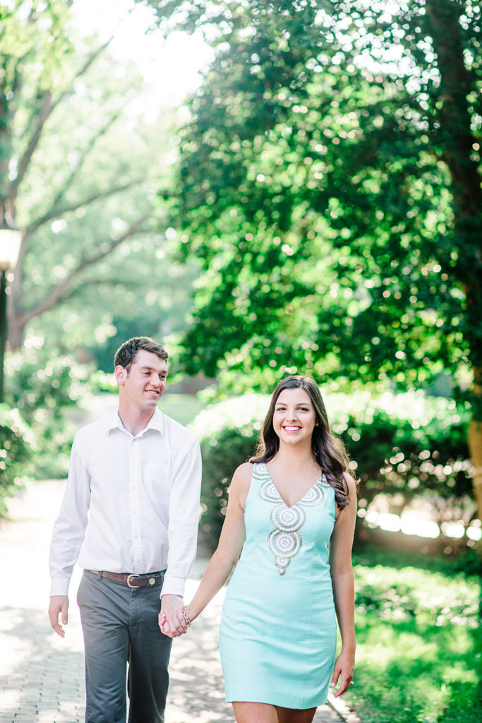 A couple wearing classic clothing for their engagement session outside of Raleigh, NC