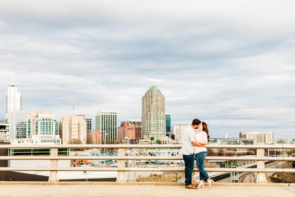 Romantic engagement photos of the downtown Raleigh skyline