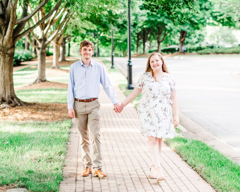 a couple walking at the Azalea Gardens in Raleigh