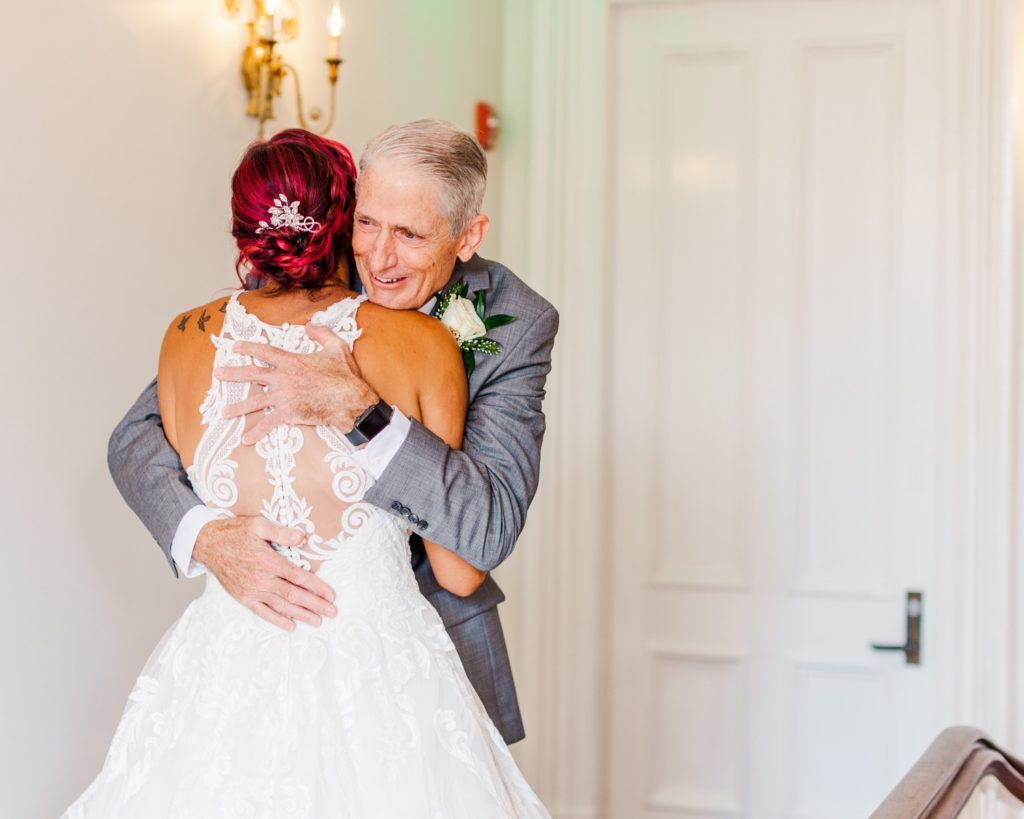 Dad and daughter seeing each other for the first time on the wedding day