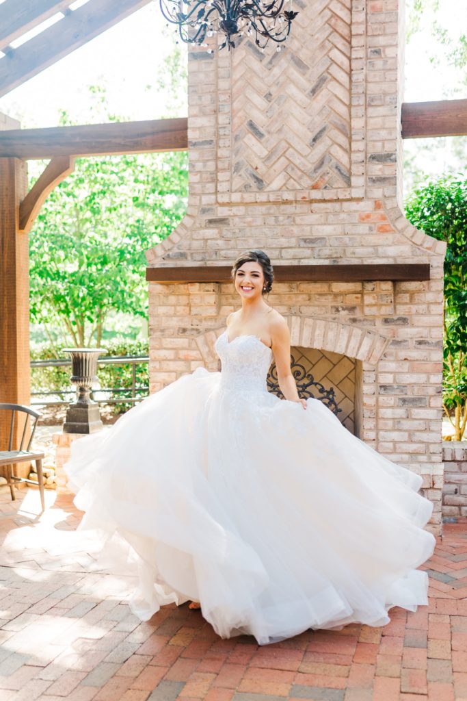 A bride twirling in her wedding dress in Raleigh, NC