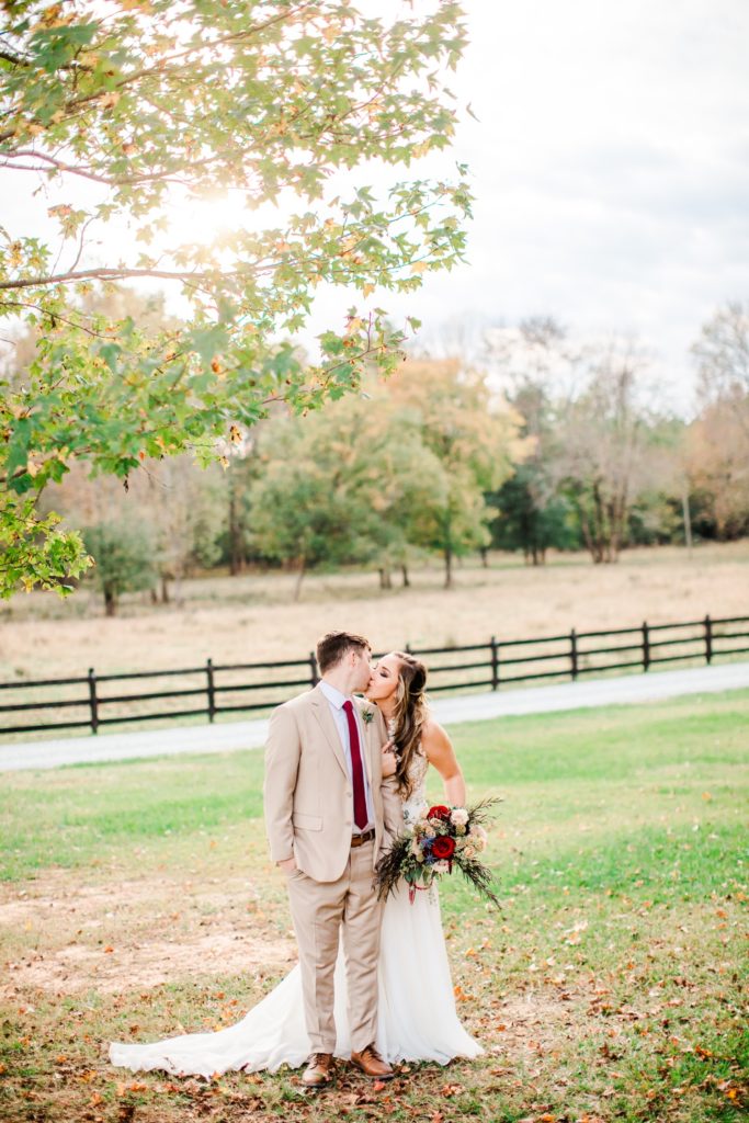 A couple taking portraits during their Oakland Farm, Raleigh, NC wedding day