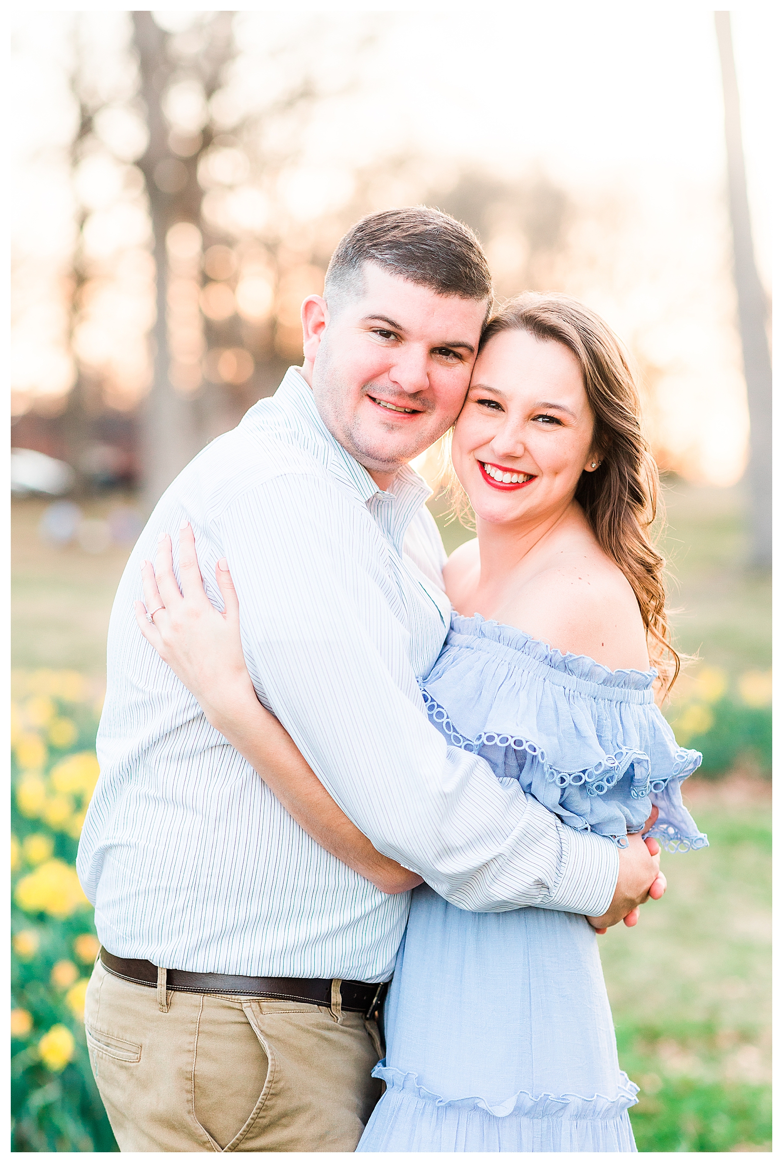 A couple posing for their engagement session at Dix Park in Raleigh, NC