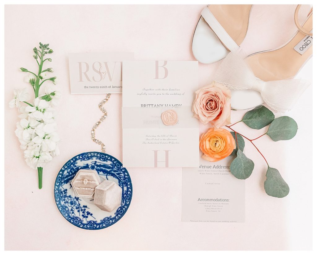 An invitation flat lay at The Sutherland photographed by Raleigh wedding photographer