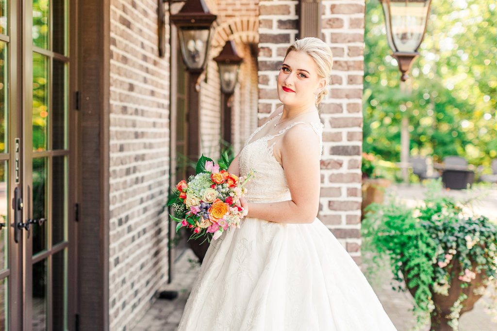 A bride posing for her portrait at Catawba Falls Event Center captured by Tierney Riggs Photography