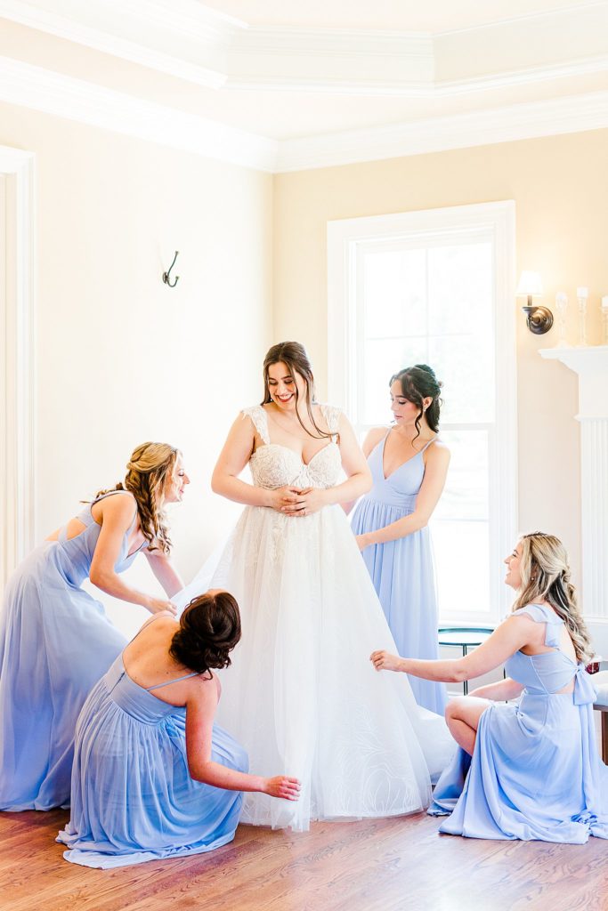 Bride with her bridesmaids at The Oaks at Salem in Apex captured by Tierney Riggs Photography