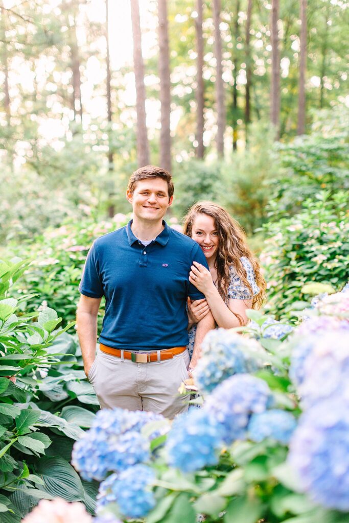 A couple posing for their engagement photos in Raleigh, NC