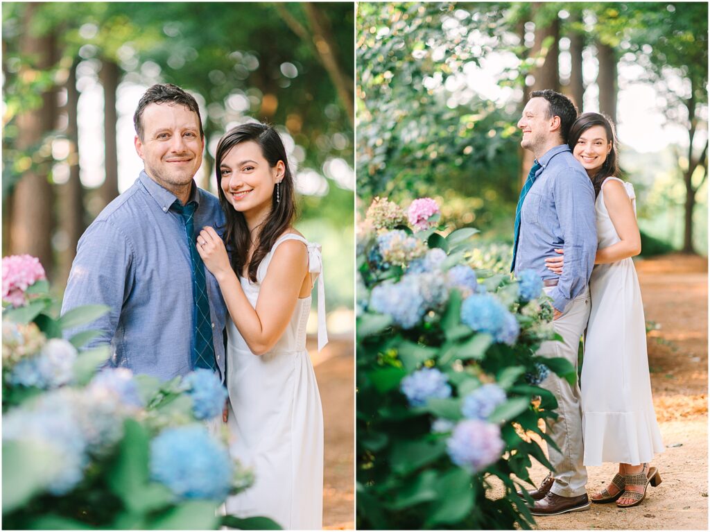 A couple smiling in the Raleigh, NC gardens for their engagement photos