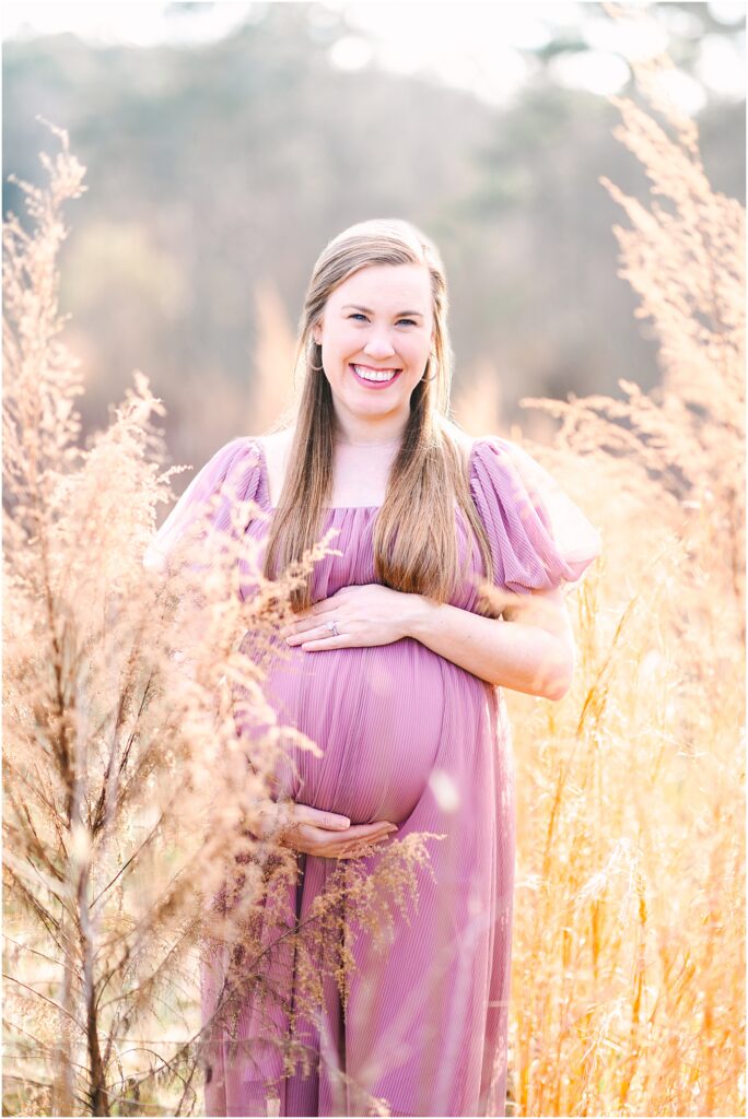 An expecting mother in a grassy field