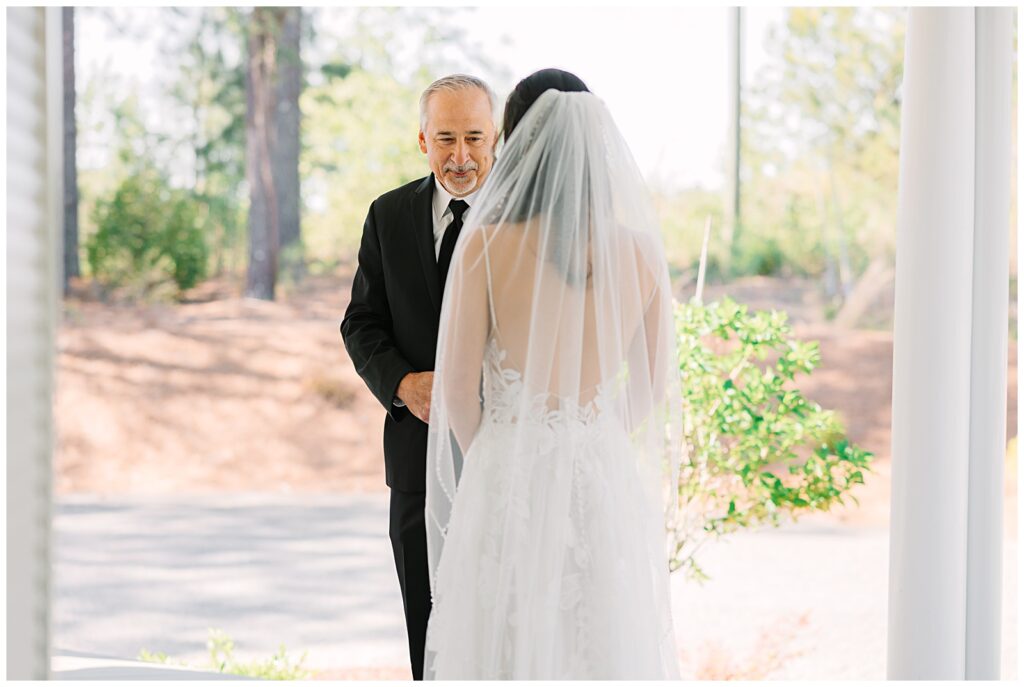 A father daughter first look on the front porch of the Upchurch