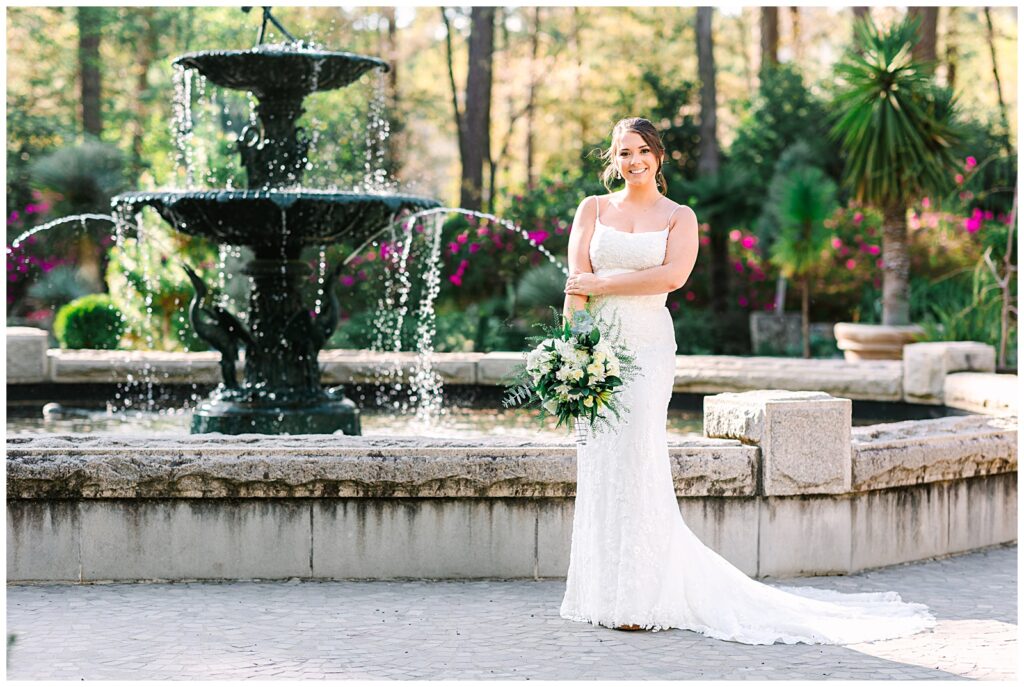 A bride in front of the fountain at Duke Gardens