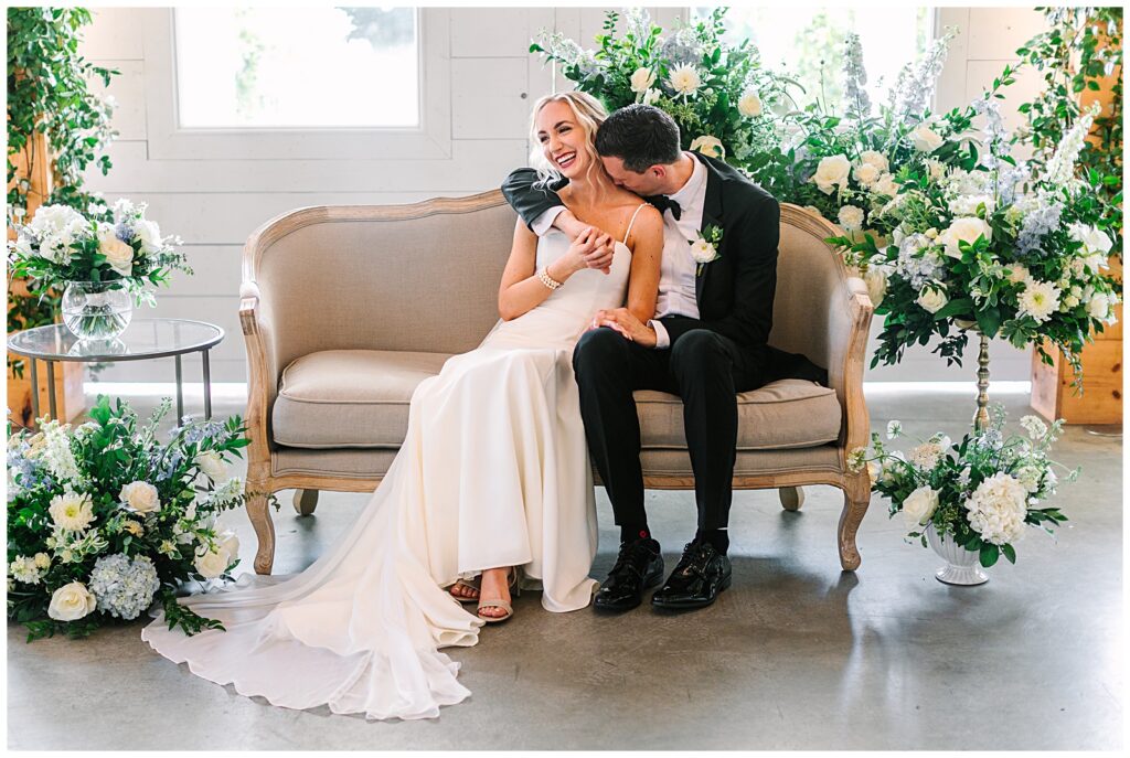 A couple sitting together for their wedding reception