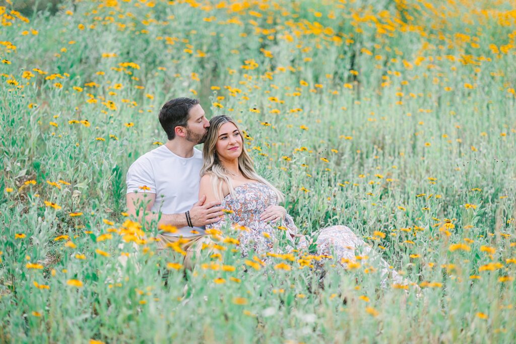 A photo of a couple a field taken by Tierney Riggs.